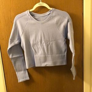 Powder Blue Crop Top, with long sleeves.